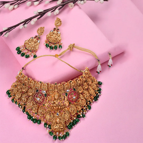 https://soulstylez.com/products/gold-plated-kemp-stone-studded-lakshmi-design-with-dangling-green-beads-choker-set